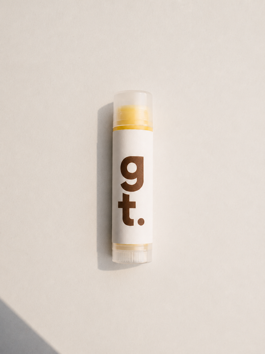 Lip Balm with G T brown logo on it on white background